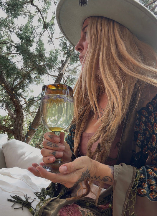 Women drinking Egyptian blue lotus tea
